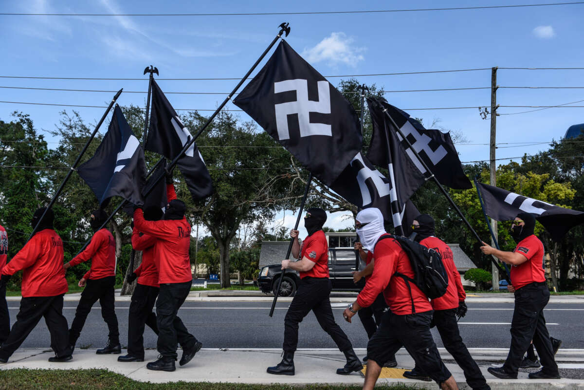 Neo-Nazis march with swastika flags as groups Blood Tribe and Goyim Defense League hold a rally on September 2, 2023, in Orlando, Florida.