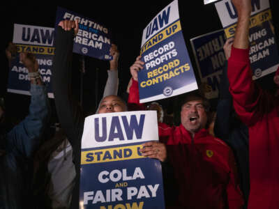 Supporters and workers cheer as United Auto Workers members go on strike at the Ford Michigan Assembly Plant on September 15, 2023, in Wayne, Michigan.