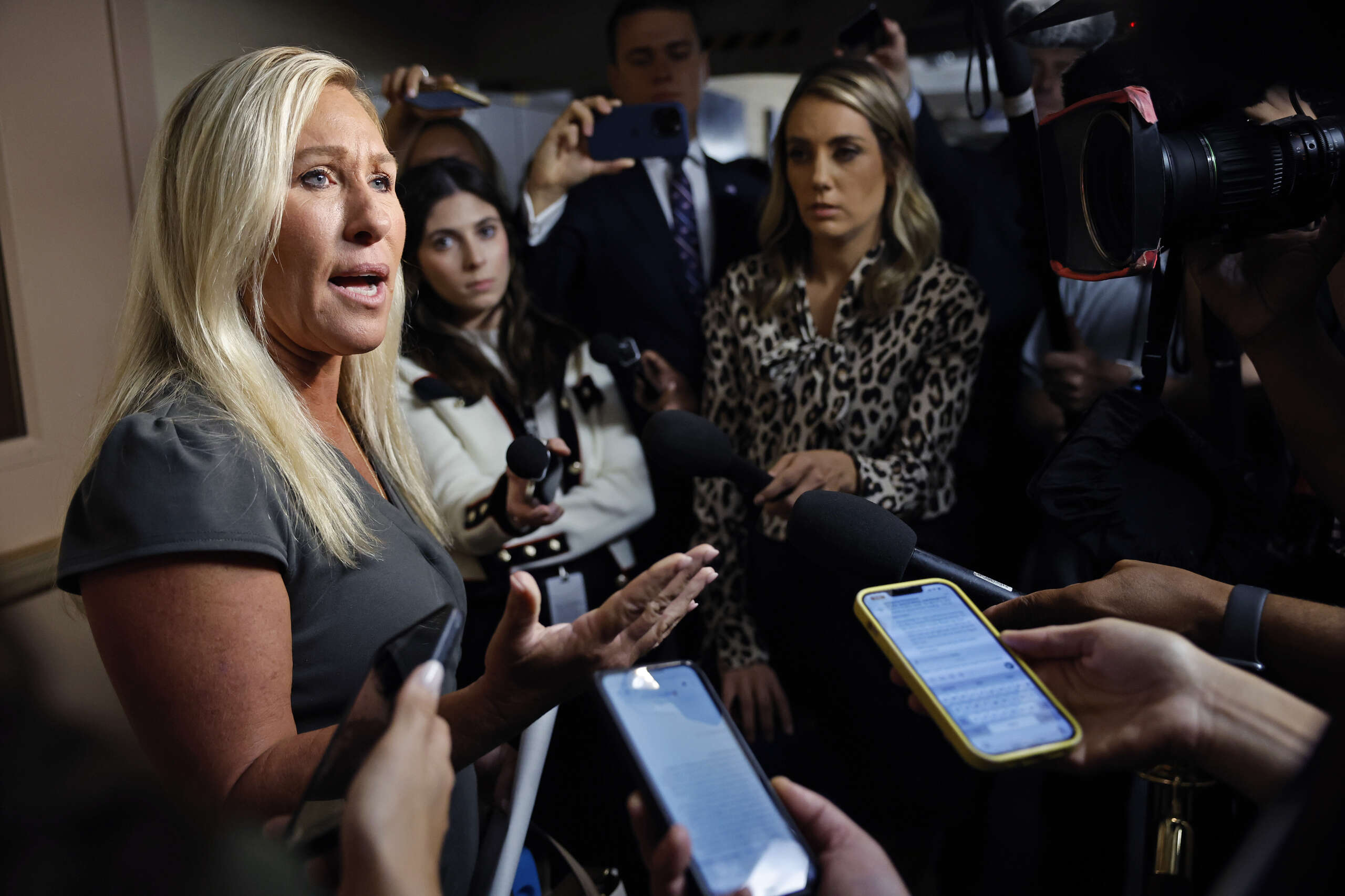 Rep. Majorie Taylor Greene talks to reporters