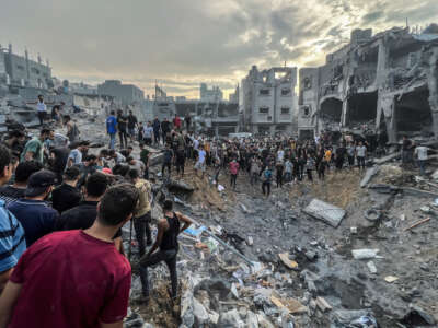 A screen grab from a video shows Palestinians searching for survivors following an Israeli airstrike in the Jabalia refugee camp north of Gaza City.