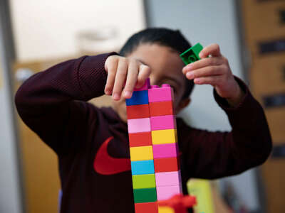 A child participates in activities at the Head Start classroom in the Carl and Norma Miller Children's Center on March 13, 2023, in Frederick, Maryland.