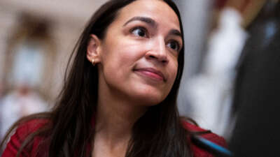 Rep. Alexandria Ocasio-Cortez talks with reporters in the U.S. Capitol's Statuary Hall on January 12, 2023.