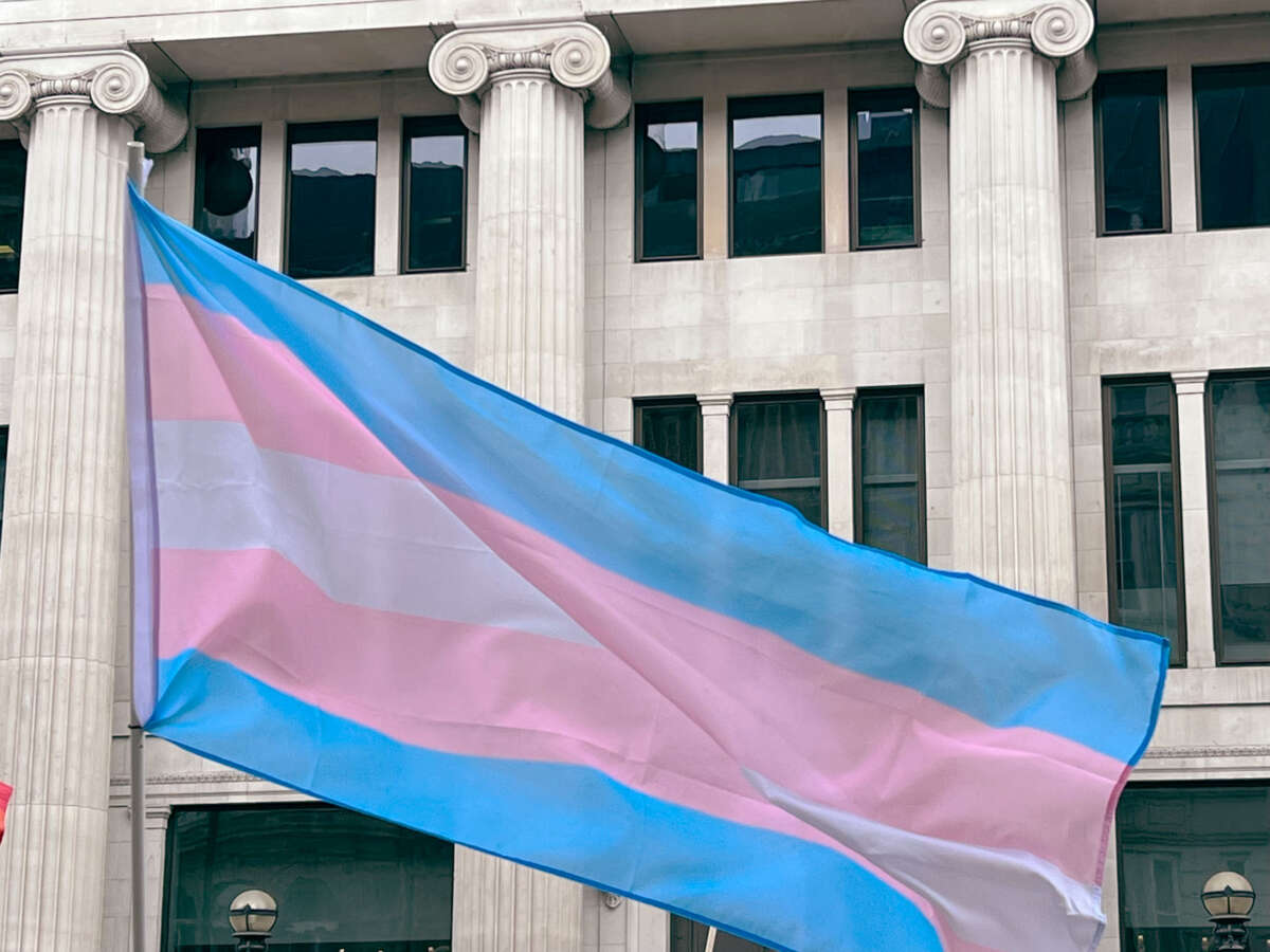 Transgender flag flying outside building