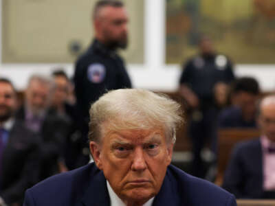 Former President Donald Trump appears in the courtroom with his lawyers for his civil fraud trial at New York State Supreme Court on October 3, 2023, in New York City.