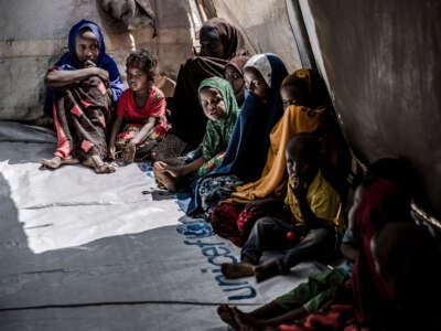 A group of displaced children, who were forced to leave their houses due to heavy rains and floods in the area, gather while attending activities for children in an United Nations tent at a displacement camp for families affected by floods located in Beledweyne, Somalia, on December 14, 2019.