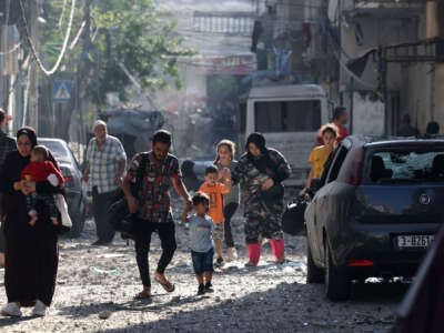 Palestinians evacuate a neighborhood in Gaza City on October 11, 2023.