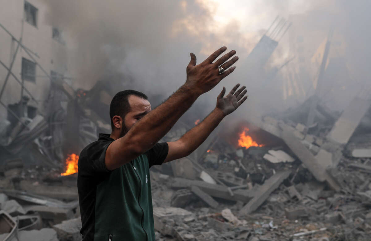 A man wails after Israeli airstrikes in Gaza City on October 9, 2023.