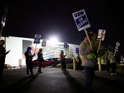 Factory workers and UAW union members form a picket line outside the Ford Motor Co. Kentucky Truck Plant in the early morning hours on October 12, 2023, in Louisville, Kentucky.