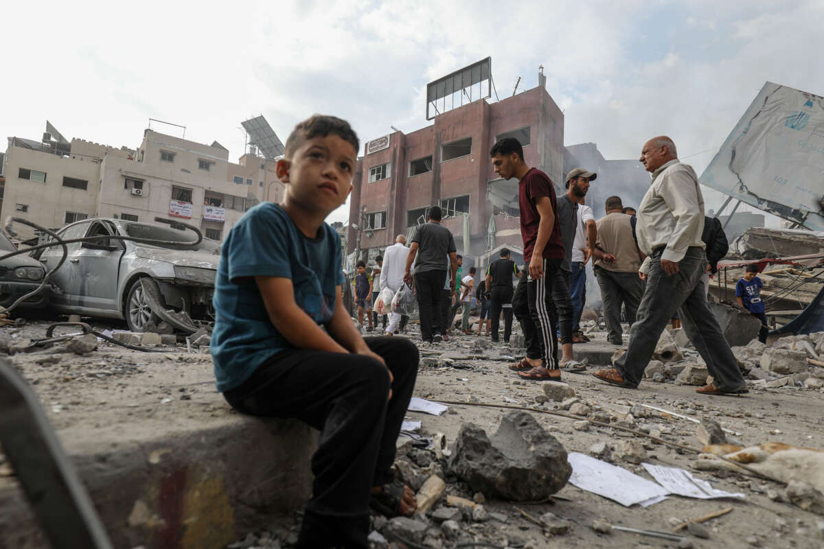 Palestinians inspect the rubble of a municipality building after Israeli airstrikes in Khan Yunis, Gaza, on October 10, 2023.