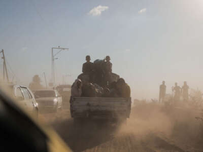 Displaced Palestinian families from the northern and central Gaza Strip evacuate toward southern Gaza on October 13, 2023.