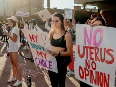 Abortion rights protesters chant during a rally at the U.S. District Court of Arizona in Tucson, Arizona, on July 4, 2022.