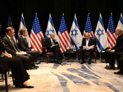 National Security Advisor Jake Sullivan (2nd L), US Secretary of State Antony Blinken (3rd L) and U.S. President Joe Biden (4th L) listen to Israel's Prime Minister Benjamin Netanyahu as they join a meeting of the Israeli war cabinet in Tel Aviv on October 18, 2023, amid the ongoing battles between Israel and the Palestinian group Hamas.