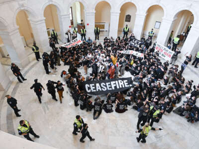 Police personnel detain demonstrators as they gather in the rotunda in the Cannon House Office Building during a Jewish Voice for Peace event looking for a ceasefire in the Israel and Gaza conflict on October 18, 2023, in Washington, D.C.