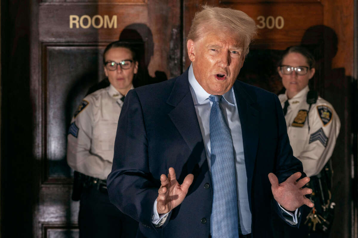 Former President Donald Trump addresses the media before leaving the courthouse for the day at the New York State Supreme Court in New York on October 18, 2023.