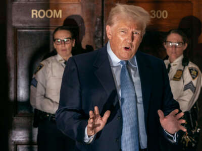 Former President Donald Trump addresses the media before leaving the courthouse for the day at the New York State Supreme Court in New York on October 18, 2023.
