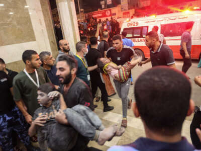 Palestinians injured in Israeli air raids arrive at Nasser Medical Hospital on October 24, 2023, in Khan Yunis, in the southern Gaza Strip, Gaza.