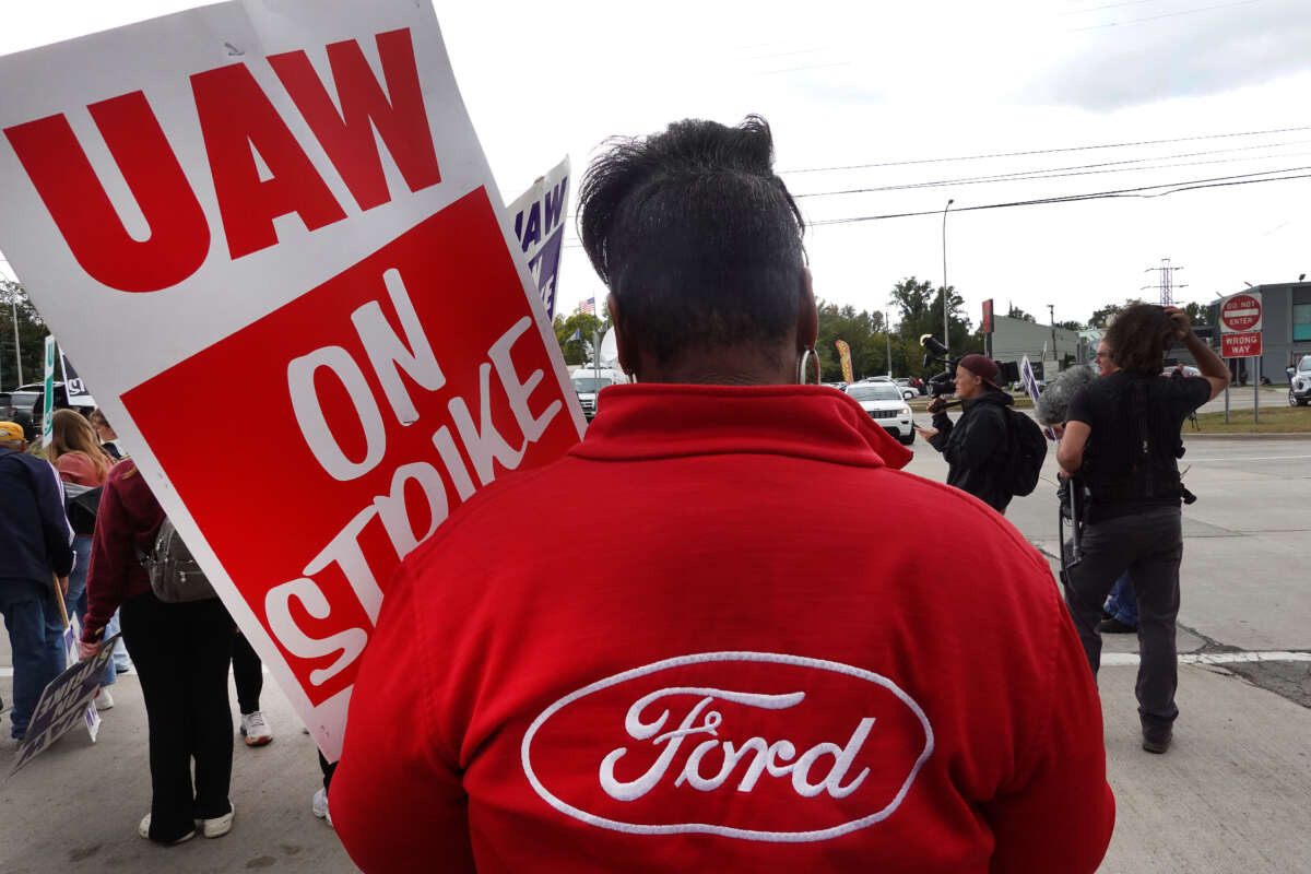 UAW workers picket outside of Ford's assembly plant on September 26, 2023, in Wayne, Michigan.