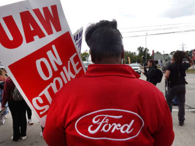 UAW workers picket outside of Ford's assembly plant on September 26, 2023, in Wayne, Michigan.