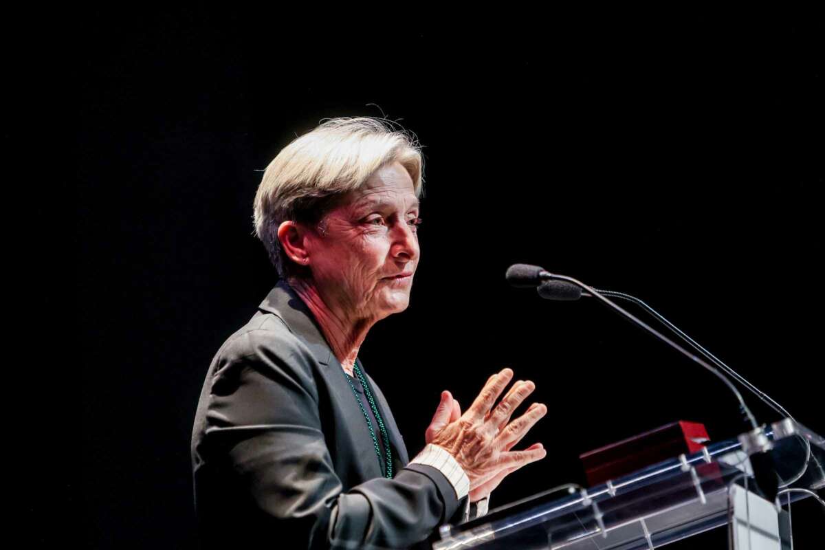 Judith Butler speaks at a podium