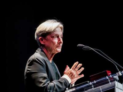 Judith Butler speaks at a podium