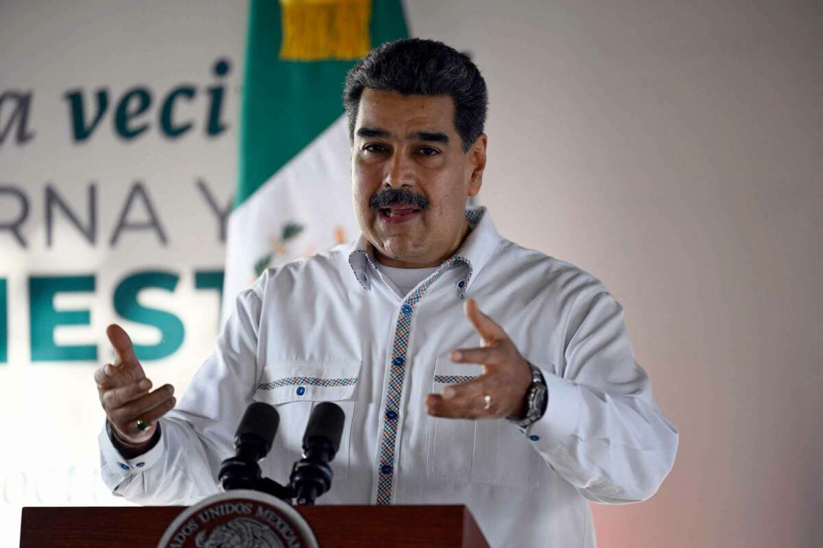 Venezuelan President Nicolas Maduro speaks at a podium