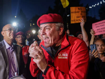 Former Republican nominee for New York City mayor and founder of self-proclaimed "crime-fighting" group Guardian Angels, Curtis Sliwa, joins protesters at John Paul Jones Park opposing the New York City Council's plan to open migrant shelters in the Bay Ridge neighborhood of Brooklyn, New York, on October 3, 2023.