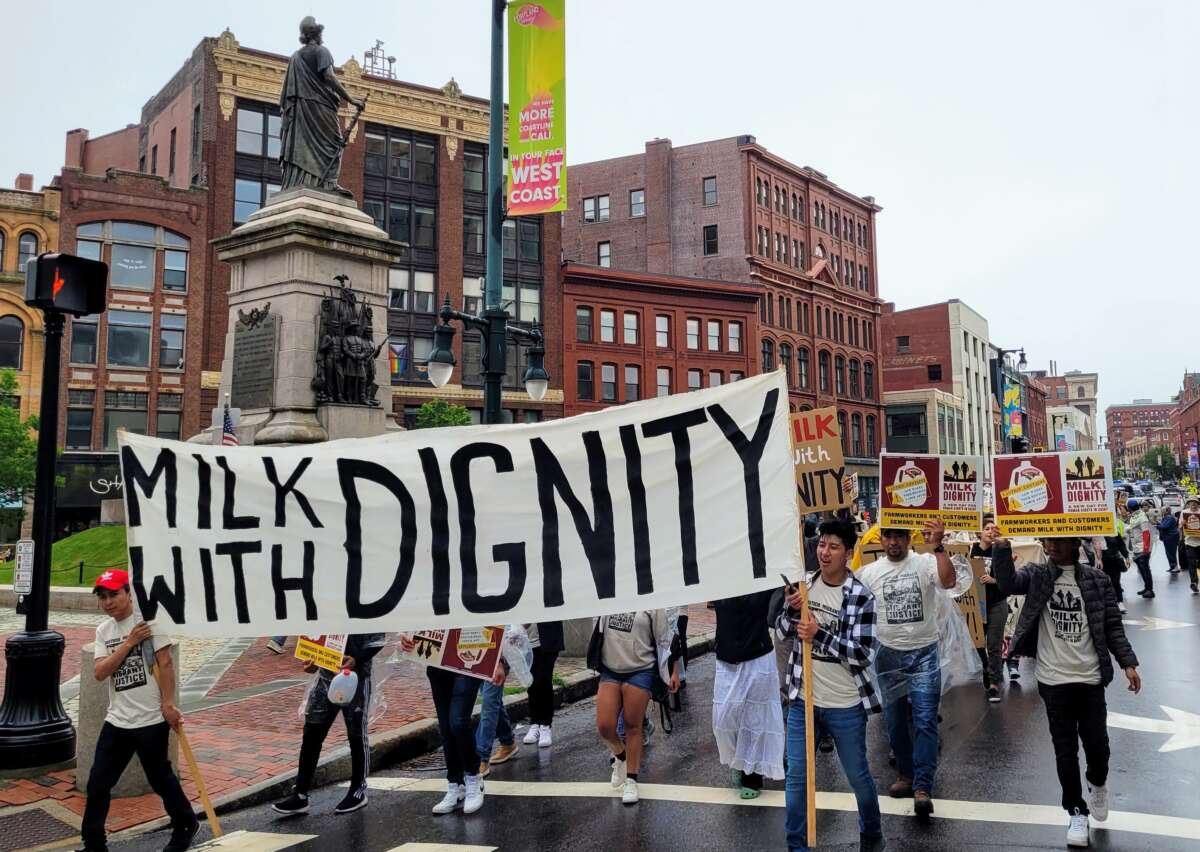 Dairy workers lead a march through Portland, Maine calling on grocery chain Hannaford Supermarket to purchase milk from dairy suppliers who have committed to a set of fair labor practices, on June 24, 2023.