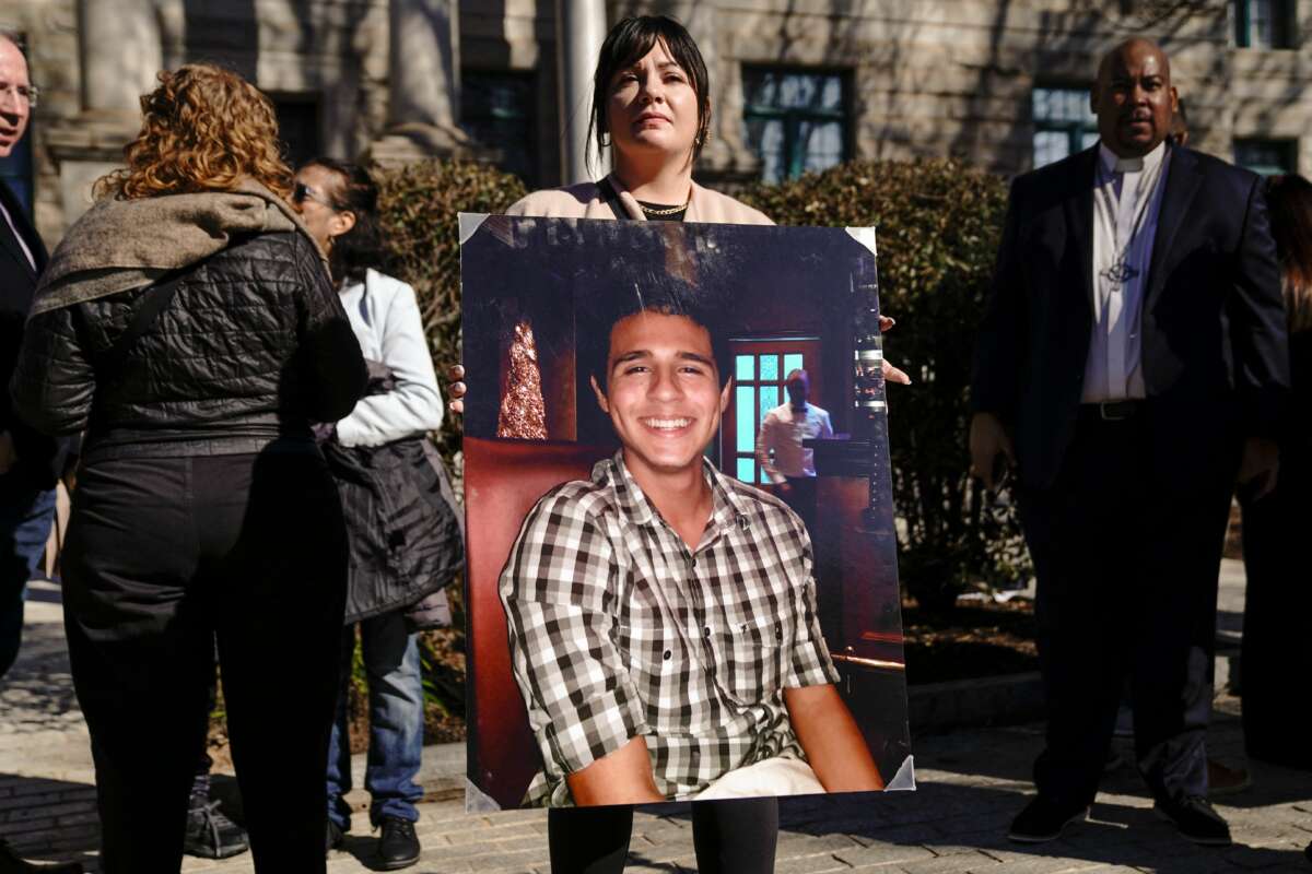 Sister-in-law, Fiona Paez, holds a photograph of environmental activist Manuel Esteban Paez Terán, better known as Tortuguita, during a press conference in Decatur, Georgia on February 6, 2023.