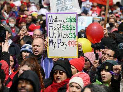 Los Angeles public school support staff, teachers, and supporters rally outside of the school district headquarters on the first day of a three day strike in Los Angeles, California, on March 21, 2023.