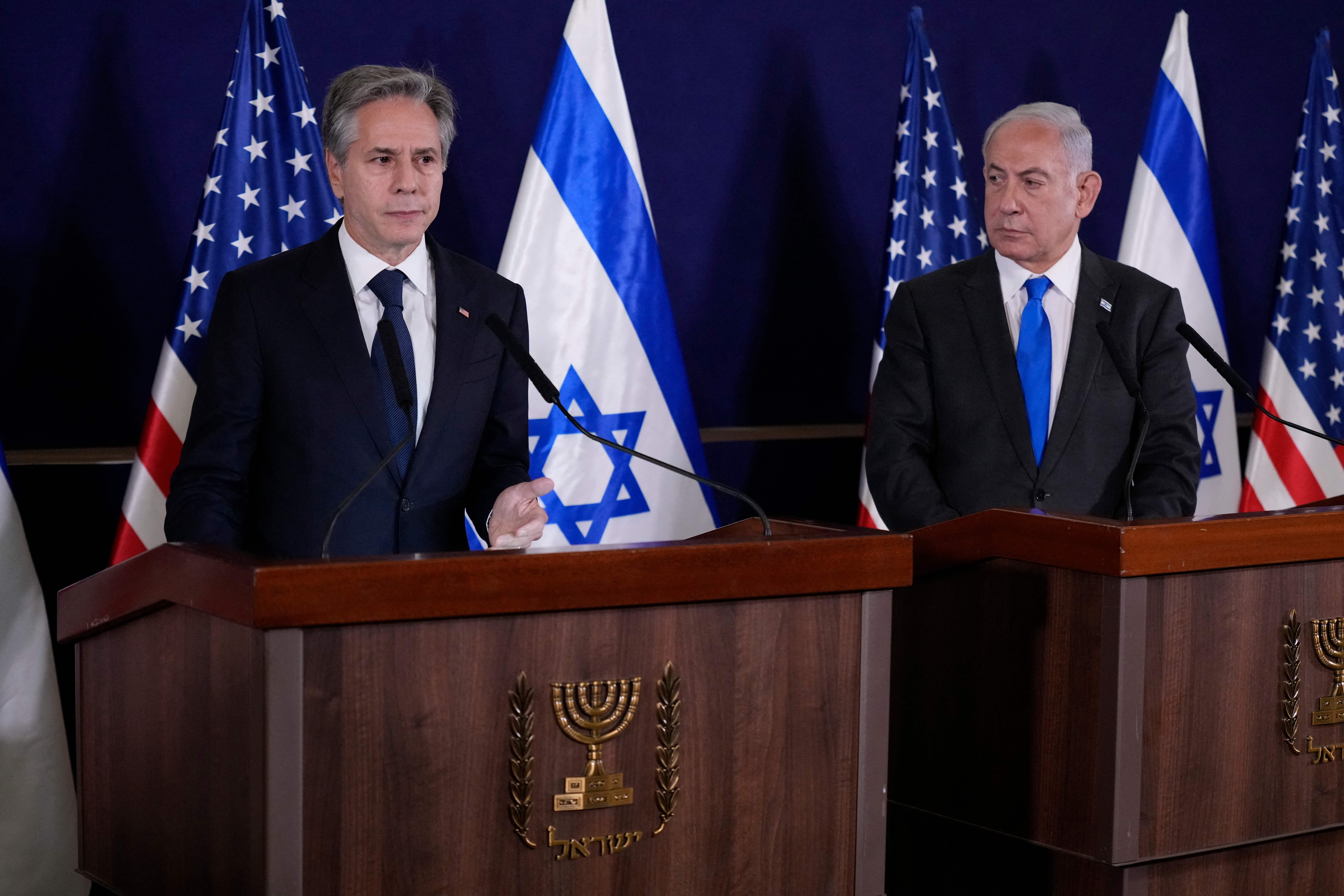 Israeli Prime Minister Benjamin Netanyahu (R) looks on as U.S. Secretary of State Antony Blinken gives statements to the media after their meeting in Tel Aviv, Israel, on October 12, 2023.