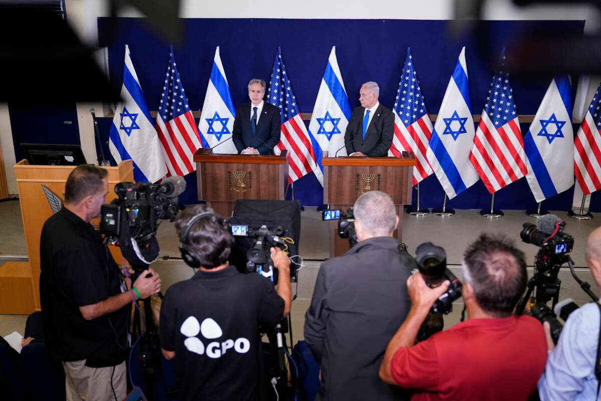 Israeli Prime Minister Benjamin Netanyahu (R) and U.S. Secretary of State Antony Blinken make statements to the media, inside The Kirya, which houses the Israeli Ministry of Defense, after their meeting in Tel Aviv on October 12, 2023.