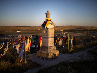 Peace offerings of tobacco ties line the fence at Wounded Knee Memorial