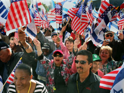 Christian Zionists wave Israeli and US flags during a rally