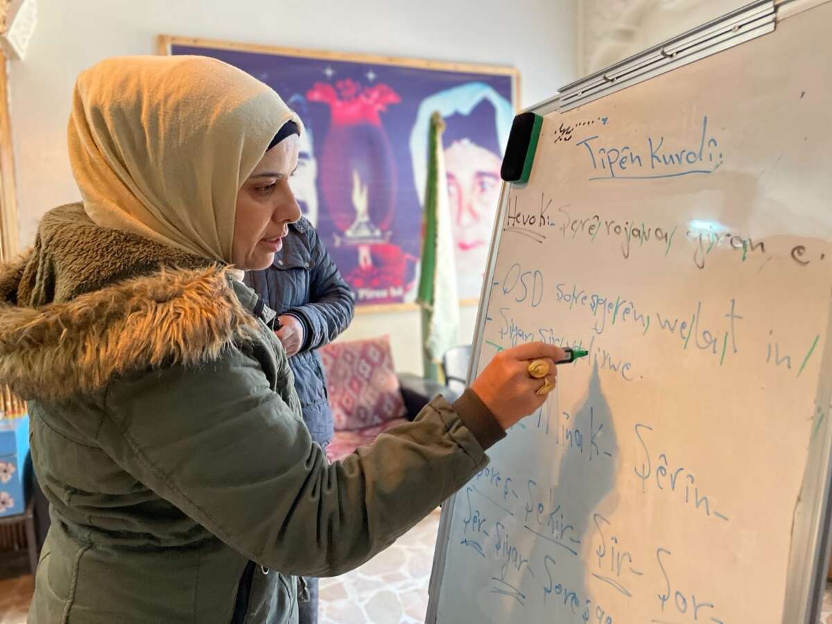 Women learn to write Kurdish at Mala Jin in Qamishlo, a city in northeast Syria, in 2023.