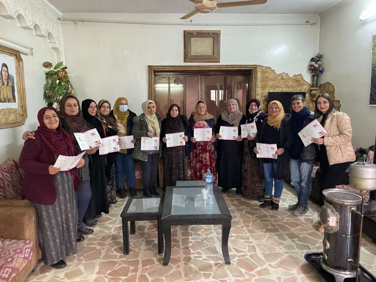 Women receive a breast cancer prevention certificate from the Kurdish Red Crescent at Mala Jin during 2023 in Qamishlo, a city in northeast Syria.