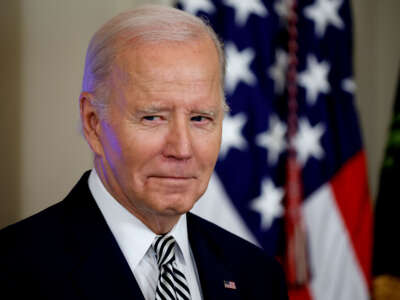 President Joe Biden listens as Vice President Kamala Harris introduces him during an event about his administration's approach to artificial intelligence in the East Room of the White House on October 30, 2023, in Washington, D.C.