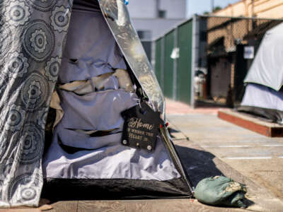 A tent is decorated with a sign that reads, Home is where the Heart is, at the Urban Alchemy homeless site, along South Central Avenue, in Los Angeles, California, on August 14, 2023.