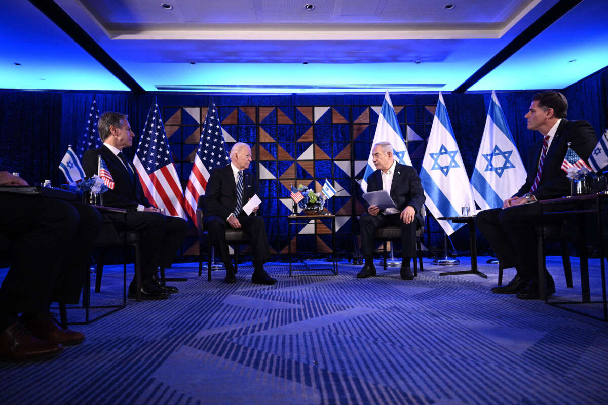 Secretary of State Antony Blinken (left) listens as President Joe Biden and Israel's Prime Minister Benjamin Netanyahu wait to make statements before a meeting in Tel Aviv, on October 18, 2023.