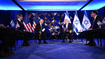 Secretary of State Antony Blinken (left) listens as President Joe Biden and Israel's Prime Minister Benjamin Netanyahu wait to make statements before a meeting in Tel Aviv, on October 18, 2023.