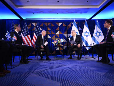 Secretary of State Antony Blinken (left) listens as President Joe Biden and Israel's Prime Minister Benjamin Netanyahu wait to make statements before a meeting in Tel Aviv, on October 18, 2023.