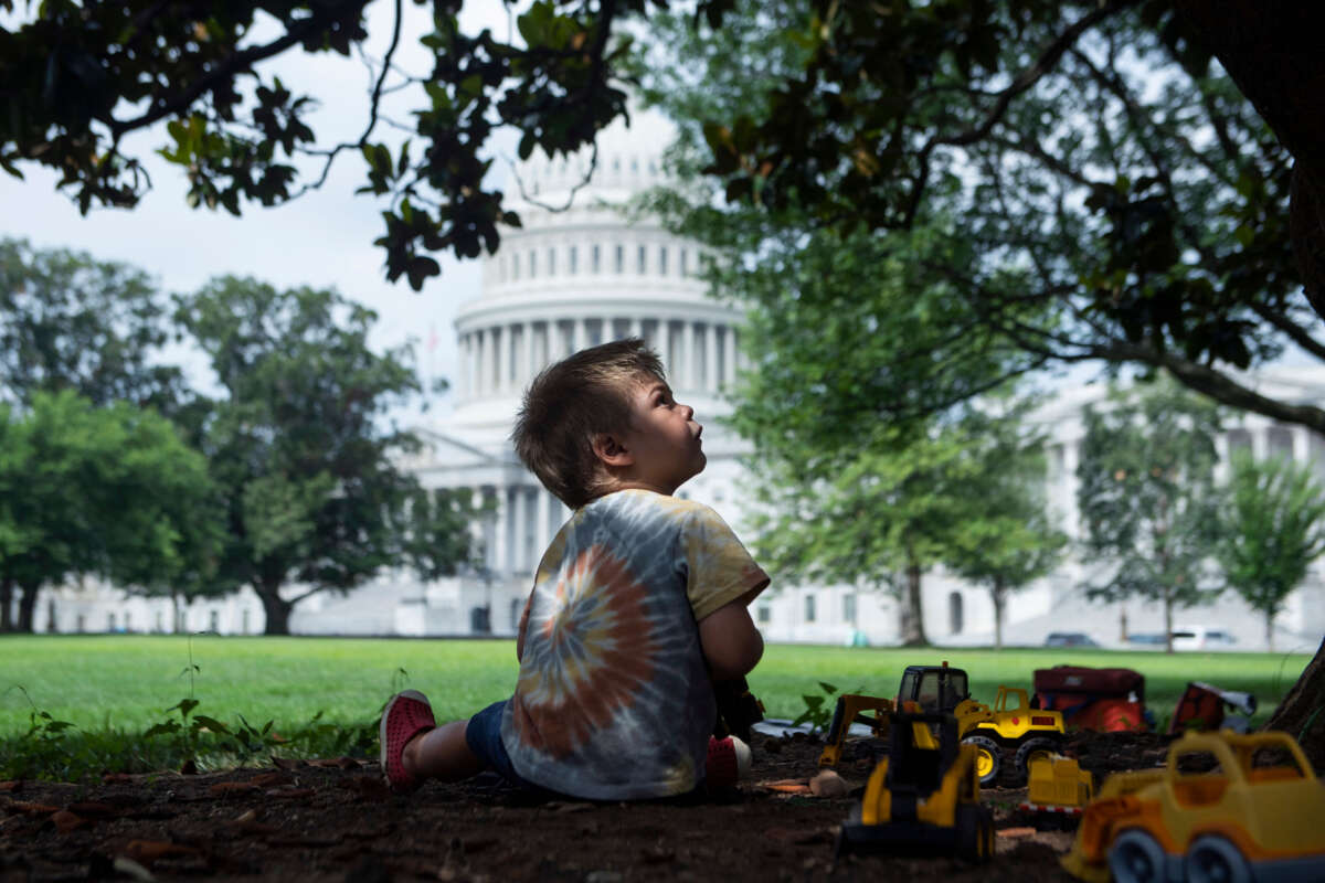 A child plays on the east front lawn of the U.S. Capitol on July 12, 2021.