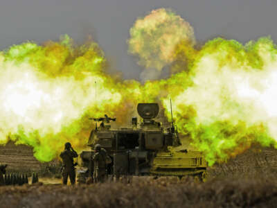 An IDF artillery unit fires towards Gaza on October 11, 2023, near Netivot, Israel.