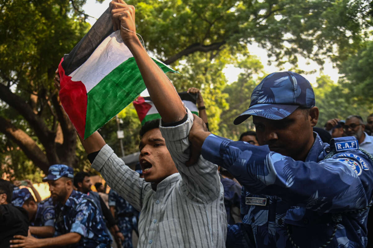 Indian police personnel detain an activist during a protest in support of Palestinians in Gaza, amid the conflict between Israel and Hamas in New Delhi, India, on October 27, 2023.