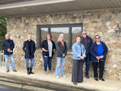 The staff of the Catherine H. Barber Memorial Shelter for people experiencing homelessness pose outside the building. The only shelter for unhoused people in the county of North Wilkesboro, North Carolina, the shelter successfully fought back against zoning ordinances that would have prevented the shelter’s move to a permanent location.