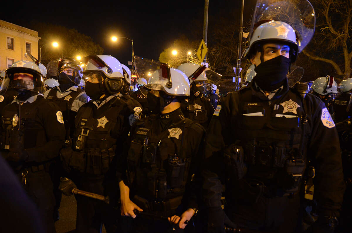 Police take security measurements as hundreds of protesters take to the streets to protest the police killing of 13 year-old Adam Toledo, in Chicago, Illinois, on April 16, 2021.