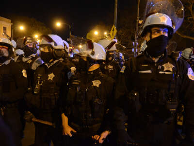 Police take security measurements as hundreds of protesters take to the streets to protest the police killing of 13 year-old Adam Toledo, in Chicago, Illinois, on April 16, 2021.