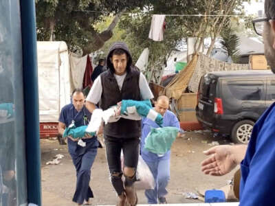 A screen grab captured from a video shows premature babies under treatment in the neonatal intensive care unit remove from the incubators and transferred to another department in the hospital after Israeli attack on Shifa Hospital in Gaza City, Gaza, on November 14, 2023.