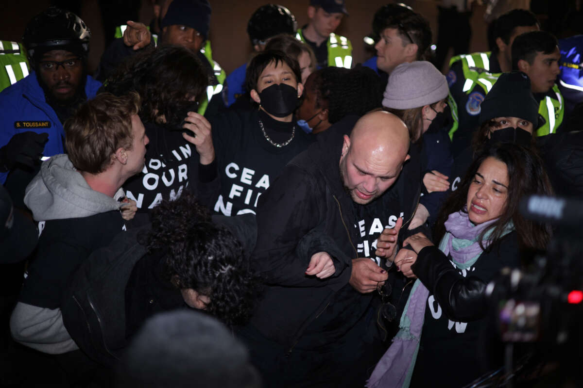 Members of U.S. Capitol Police push protesters away from the headquarters of the Democratic National Committee during a demonstration calling for a ceasefire in Gaza, on November 15, 2023, on Capitol Hill in Washington, D.C.