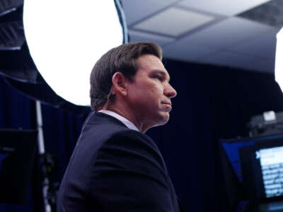 Florida Gov. Ron DeSantis speaks to reporters in the spin room at the Adrienne Arsht Center for the Performing Arts of Miami-Dade County on November 8, 2023, in Miami, Florida.
