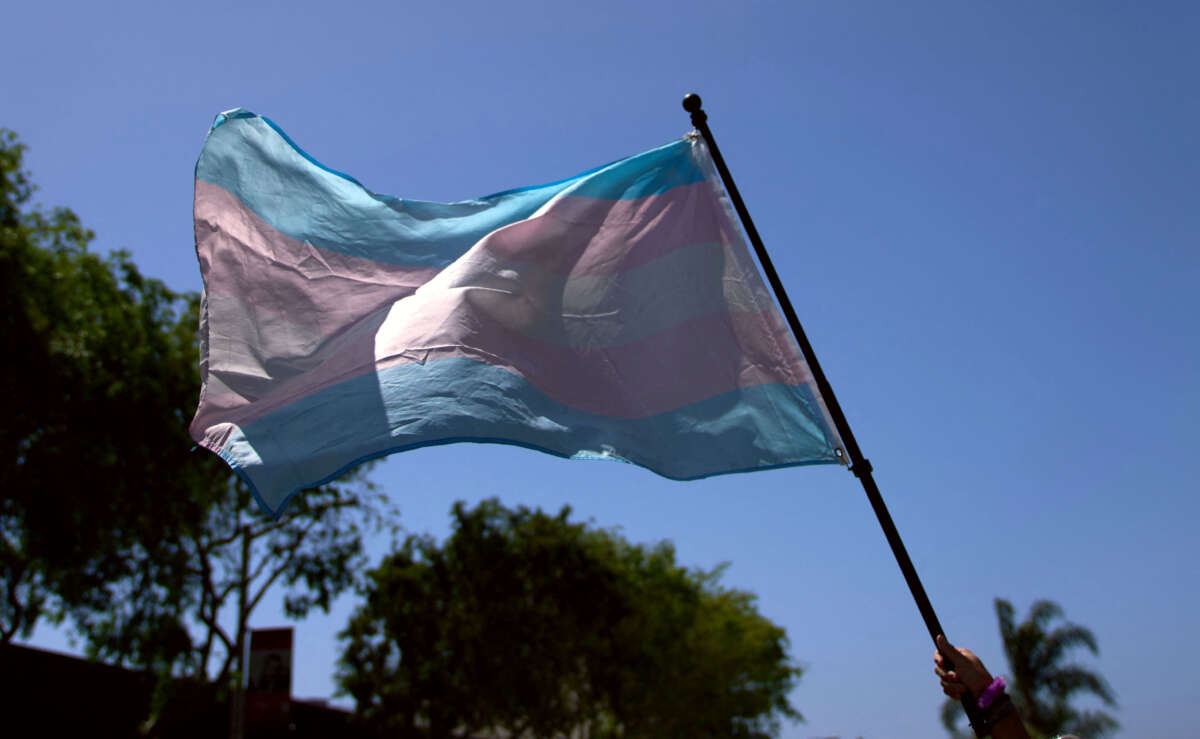 A Transgender Pride Flag is held during a march in West Hollywood, California, on April 9, 2023.